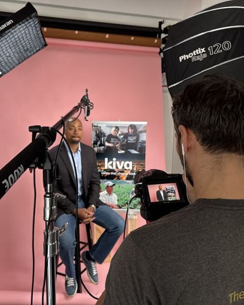 Happy Productions crew filming an interview in a studio