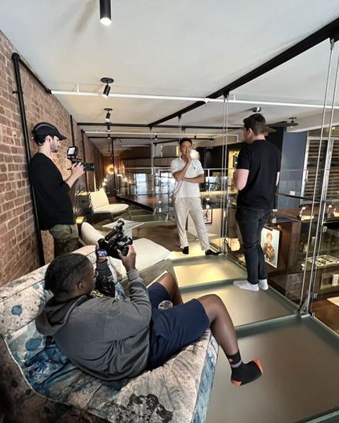 Crew setting up lights in a loft