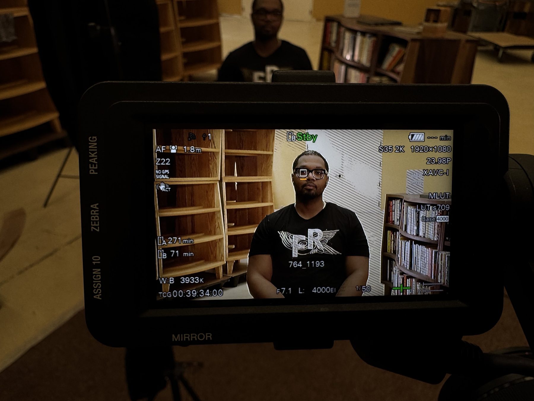 An interview framed on a cinema camera monitor