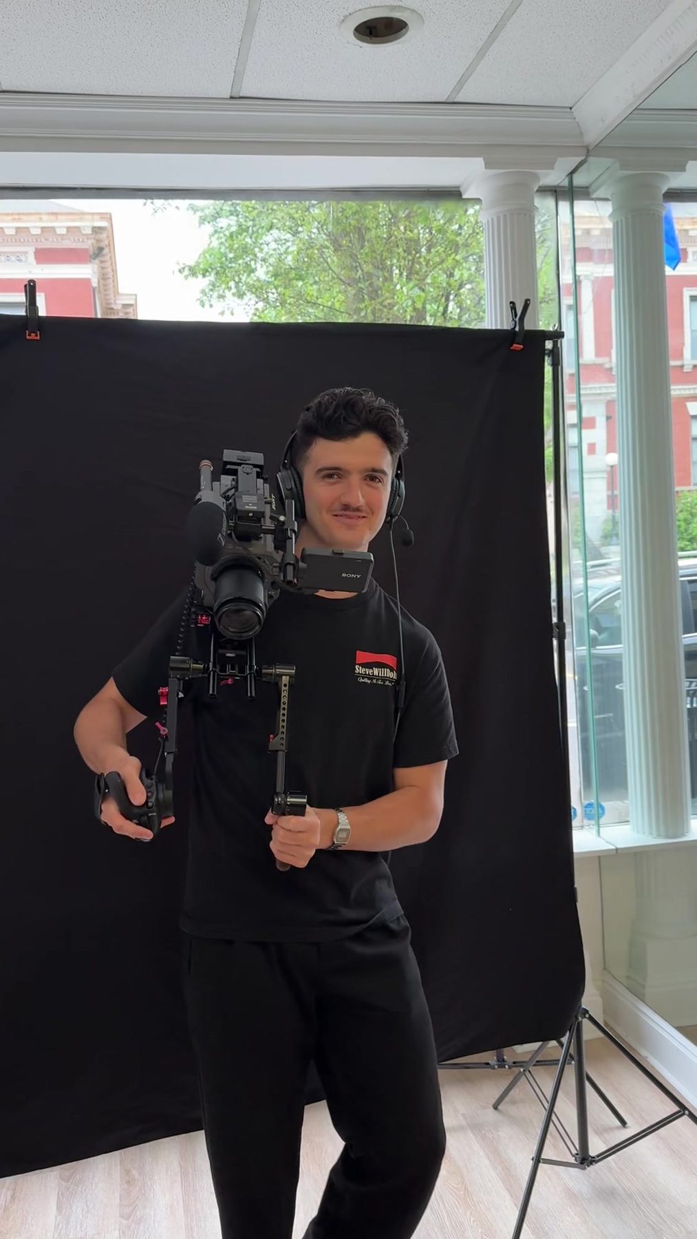 A Happy Productions camera operator with a cinema camera rig